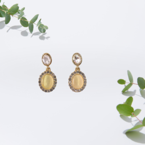 Oval crystal drop earrings with sparkling top stone and delicate accents